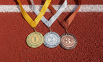 De geschiedenis van goud, zilver en brons bij prijsuitreikingen